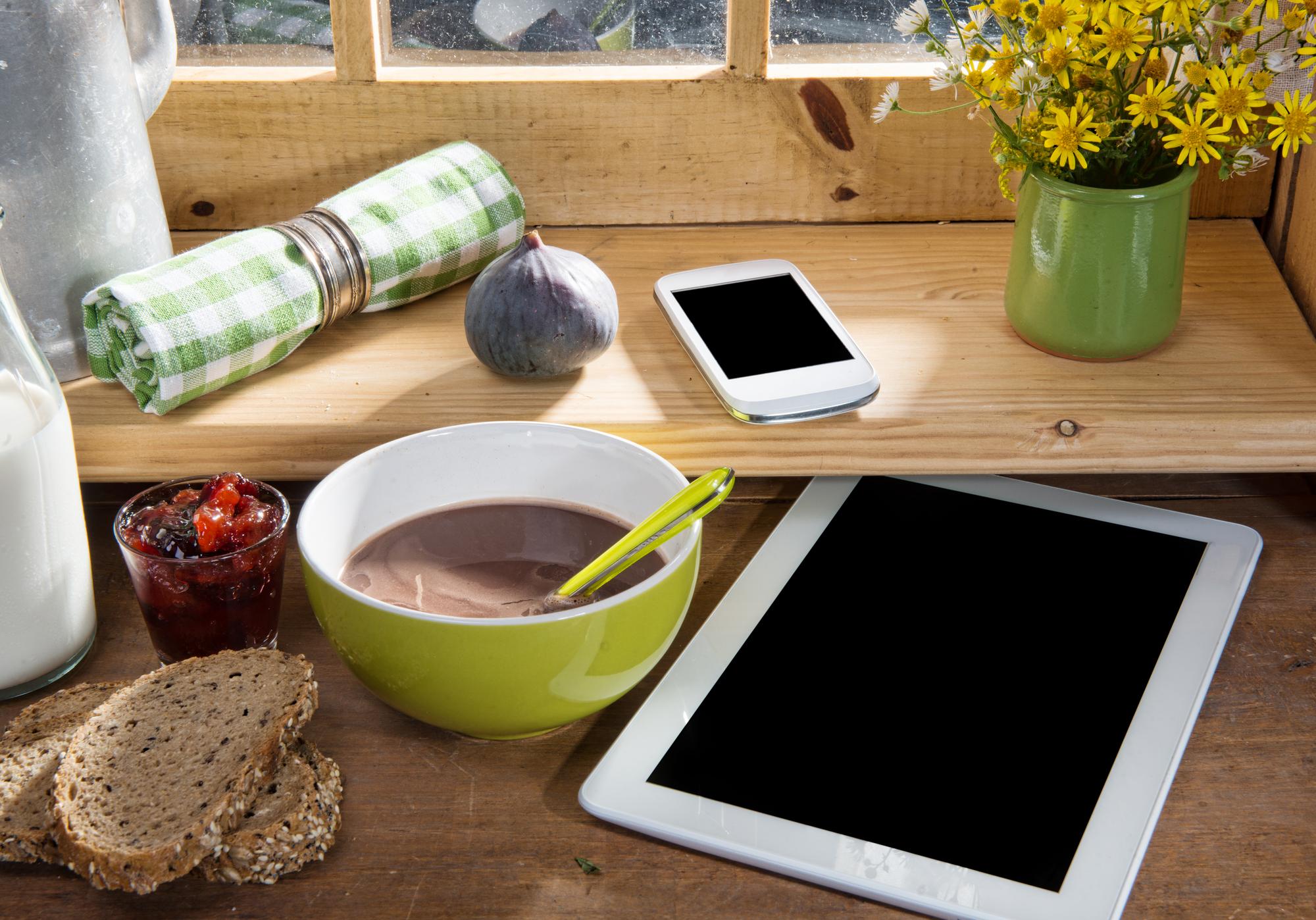 Cozy kitchen workspace with ingredients and tablet showing recipe